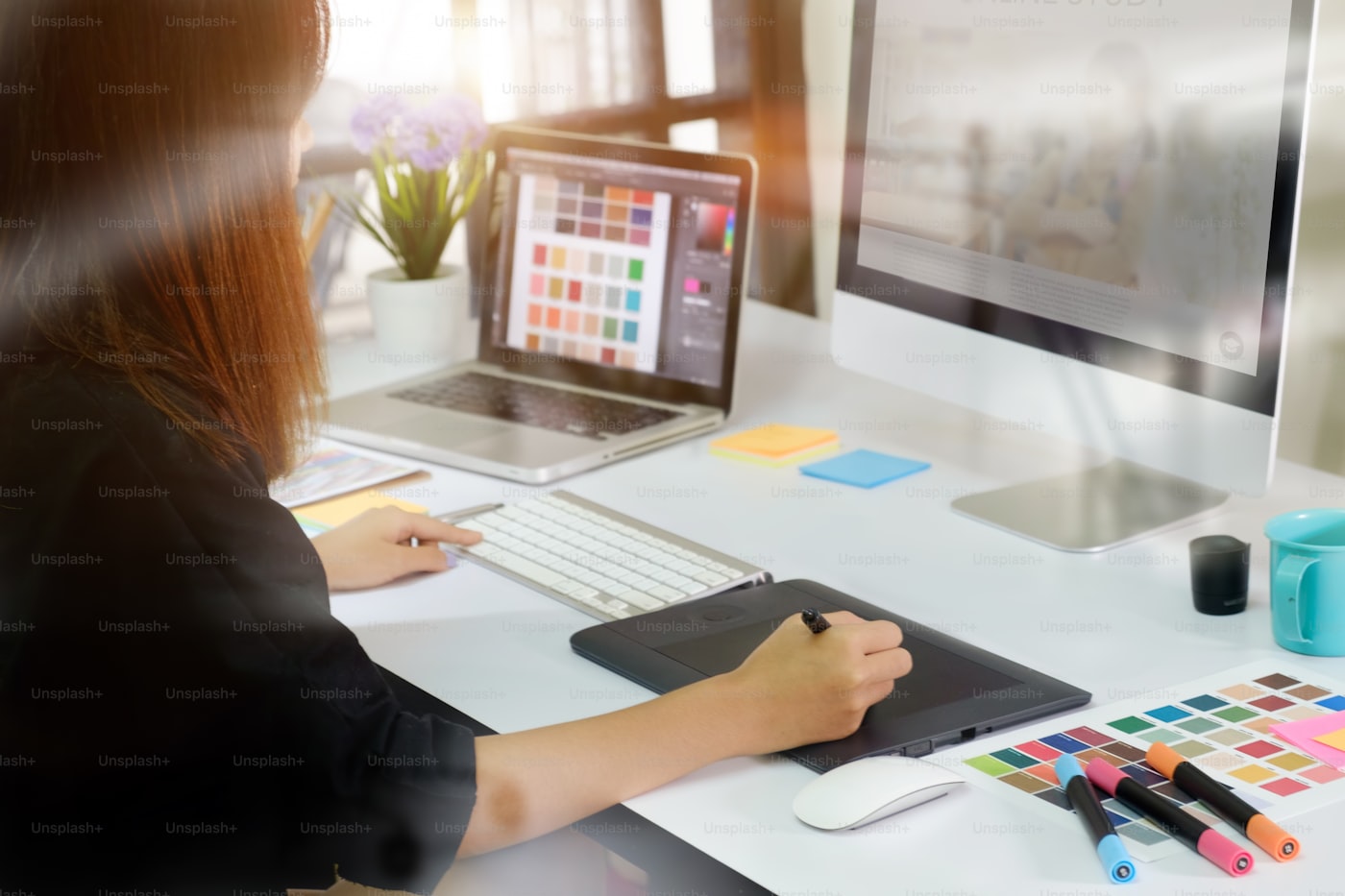Graphic designer working on a creative project with a digital tablet